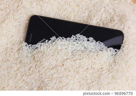 Smartphone in Bowl of White Rice to Remove Water From Phone 96896770
