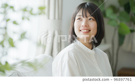 A smiling middle-aged woman.. 96897761