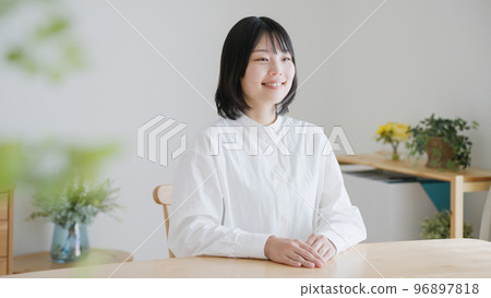 A smiling middle-aged woman.. 96897818