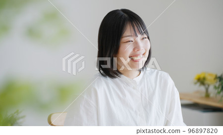 A smiling middle-aged woman.. A smiling middle-aged woman.. 96897820