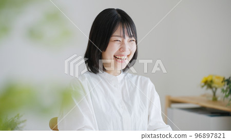 A smiling middle-aged woman.. A smiling middle-aged woman.. 96897821