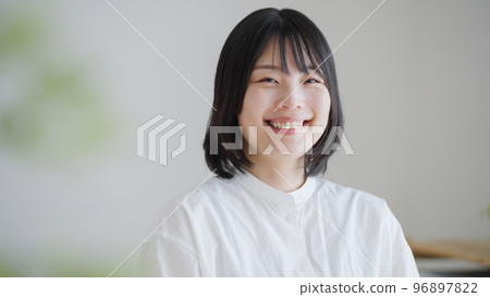 A smiling middle-aged woman.. 96897822