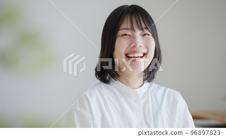 A smiling middle-aged woman.. A smiling middle-aged woman.. 96897823