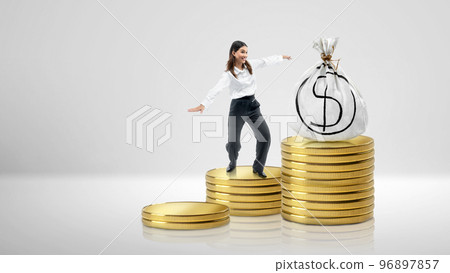 Asian businesswoman climbing coin stairs to get wealth 96897857