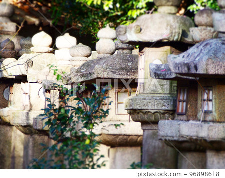 row of stone lanterns 96898618