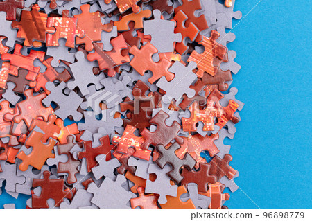Colorful Jigsaw Puzzle on Blue Background 96898779