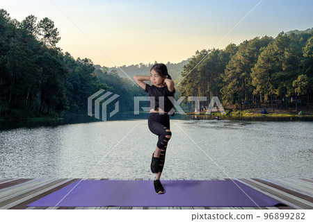 Young Asian Girl exercise in the nature 96899282