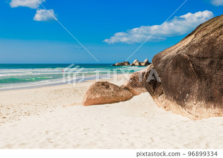 Tropical beach with amazing rocks and ocean waves. Holiday beach banner Tropical beach with amazing rocks and ocean waves. Holiday beach banner 96899334