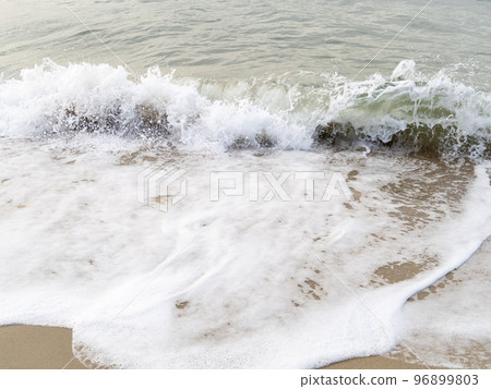 Waves on the sandy beach. Waves on the sandy beach. 96899803