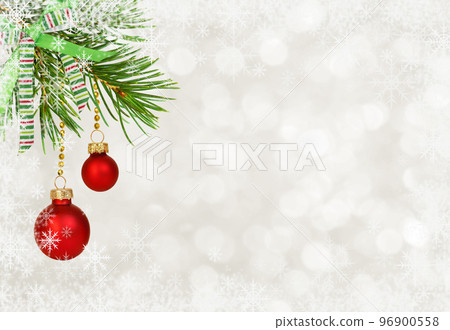 Twig of Christmas tree with red balls and festive ribbon bow on white bokeh background 96900558