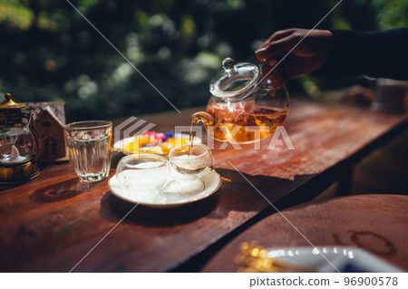 flower tea,Tea set on the terrace, natural background flower tea,Tea set on the terrace, natural background 96900578