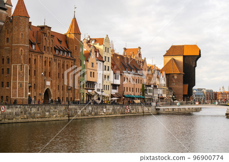 Ancient crane - zuraw Old town in Gdansk. The riverside on Granary Island reflection in Moltawa River. Visit Gdansk Poland Travel destination 96900774