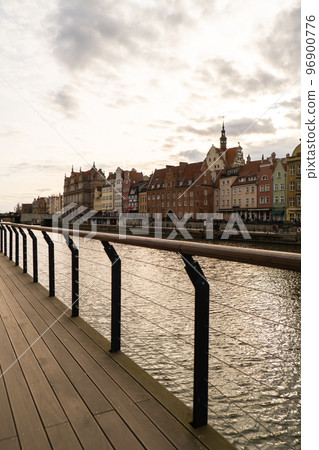 Old town in Gdansk. The riverside on Granary Island reflection in Moltawa River Cityscap. Ancient crane at dusk. Visit Gdansk Poland Travel destination 96900776