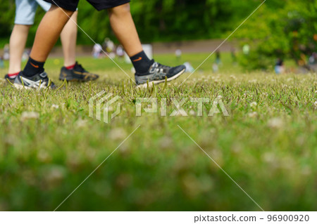 Feet of children walking in the park Feet of children walking in the park 96900920