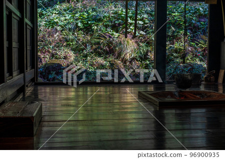 The polished floor of an old folk house with a sunken hearth The polished floor of an old folk house with a sunken hearth 96900935