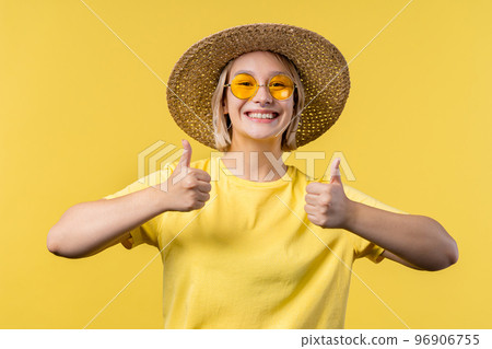 Positive woman makes hand sign like, thumbs up gesture. Happy girl, correct perfect choice, great Positive woman makes hand sign like, thumbs up gesture. Happy girl, correct perfect choice, great 96906755