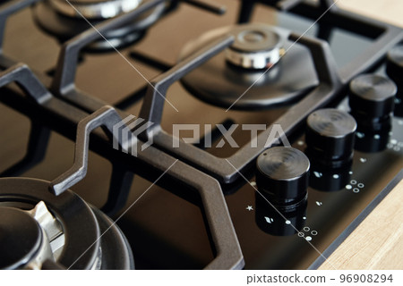 Gas stove with hob in kitchen, close up Gas stove with hob in kitchen, close up 96908294