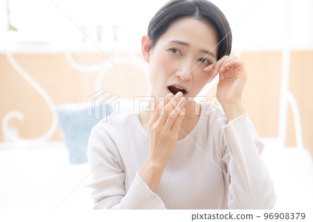 A woman's up that can be used for the image of lack of sleep and hay fever 96908379