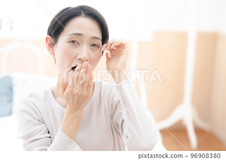 A woman's up that can be used for the image of lack of sleep and hay fever A woman's up that can be used for the image of lack of sleep and hay fever 96908380