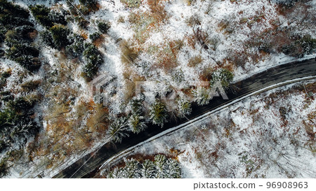 Aerial high angle view of narrow winding curvy mountain road. 96908963