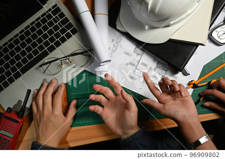 Cropped image of engineer or architect team brainstorming, planning development details at construction office 96909802