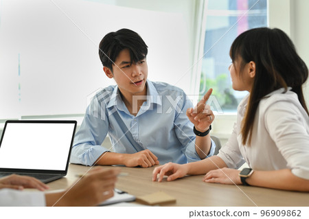 Asian couple arguing during family therapy counselling session with psychologist in clinic Asian couple arguing during family therapy counselling session with psychologist in clinic 96909862