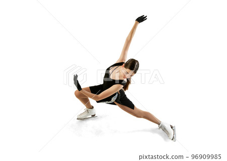 Young teen girl, junior female figure skater in black stage costume skating isolated over white background. Top view. Art, skills, sport, beauty, winter sports Young teen girl, junior female figure skater in black stage costume skating isolated over white background. Top view. Art, skills, sport, beauty, winter sports 96909985