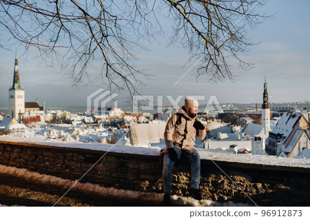 male tourist outdoors in winter in the old town of Tallinn.Estonia 96912873