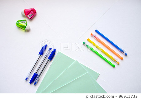 A set of stationery on a white background, pens of different colors A set of stationery on a white background, pens of different colors 96913732