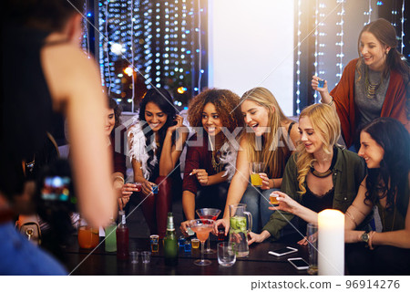 Friends, drinks and nightclub celebration on happy hour with alcohol, drinking and cocktails. Party, music and celebrate event of people at night with happiness and excited smile ready for shots 96914276