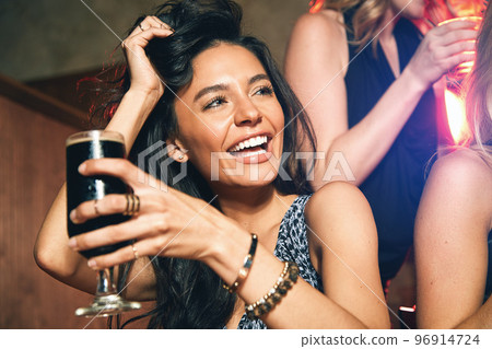 Young woman with beer, alcohol and party at nightclub with new year celebration and happiness, drinking during night out. Celebrate, cocktails and drink at happy hour with ladies night getting drunk. 96914724