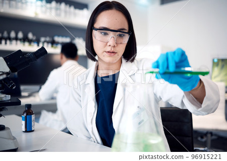 Scientist, woman with test tube and science test in lab, chemical liquid for experiment and doctor with research for scientific innovation. Chemistry, focus and chemical liquid in Japanese laboratory 96915221
