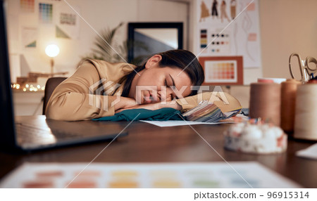 Tired, design and woman in fashion sleeping at a desk with burnout, stress and creative work in boutique at night. Fatigue, stressed and tailor or designer with clothes for fashion design in the dark Tired, design and woman in fashion sleeping at a desk with burnout, stress and creative work in boutique at night. Fatigue, stressed and tailor or designer with clothes for fashion design in the dark 96915314