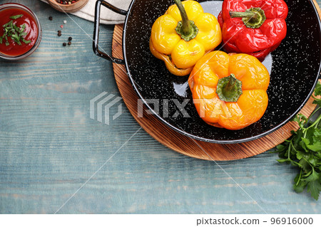 Tasty stuffed bell peppers on blue wooden table, flat lay Tasty stuffed bell peppers on blue wooden table, flat lay 96916000
