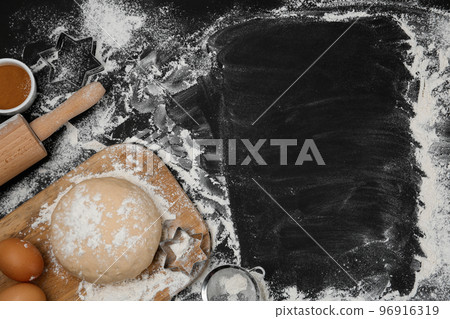 Flat lay composition with eggs and other ingredients on black table, space for text. Baking pie Flat lay composition with eggs and other ingredients on black table, space for text. Baking pie 96916319