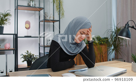 Muslim business woman use smartphone surprised sudden lottery results, bad news, fortune loss, fail Muslim business woman use smartphone surprised sudden lottery results, bad news, fortune loss, fail 96918109