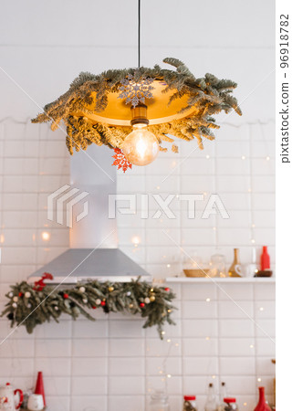 Kitchen lamp decorated for Christmas and New Year 96918782