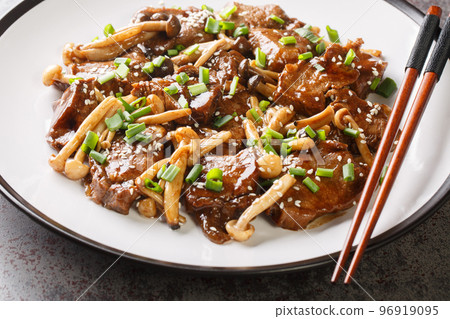 Stir-fried Beef Steak with Asian Mushroom close up on the plate. Horizontal Stir-fried Beef Steak with Asian Mushroom close up on the plate. Horizontal 96919095
