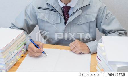Image of a construction businessman aiming to acquire qualifications while working 96919786