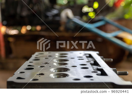 Maintenance inspection of engine valves, engine cylinder head. Repair of engine head and valves. Disassembled machine engine at modern auto service 96920441