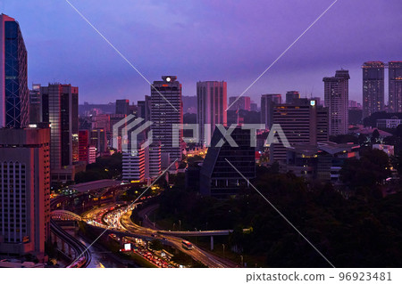 An incredible pink and purple sunset over a modern big city 96923481