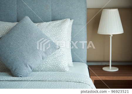 Apartment interior hotel with two single beds and bedside lamps 96923521