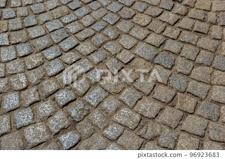 Cobblestone road. Gray cobblestone texture, vintage road surface Cobblestone road. Gray cobblestone texture, vintage road surface 96923683