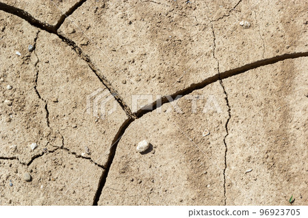 The ground has cracks in the top view for the background or graphic design with the concept of drought and death The ground has cracks in the top view for the background or graphic design with the concept of drought and death 96923705