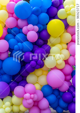 Bright abstract background of jumble of rainbow colored balloons, celebrating Bright abstract background of jumble of rainbow colored balloons, celebrating 96923717
