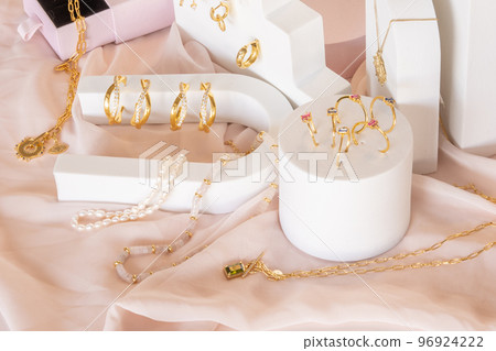 Girl jewelry accessories including earrings and necklaces on display Girl jewelry accessories including earrings and necklaces on display 96924222