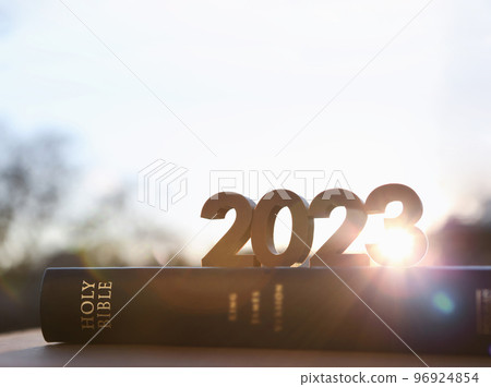 2023 new year bright sun rising, holy bible book and brilliant sunrise scenery 96924854