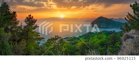 Sea bay with green trees on the shore at sunset Sea bay with green trees on the shore at sunset 96925115