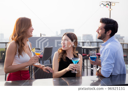 Group friends drinking cocktail and cheer in party at restaurant luxury for celebrate. Group friends drinking cocktail and cheer in party at restaurant luxury for celebrate. 96925131