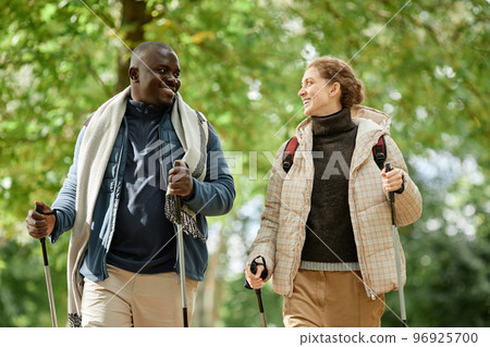 Two people Walking with Poles Two people Walking with Poles 96925700